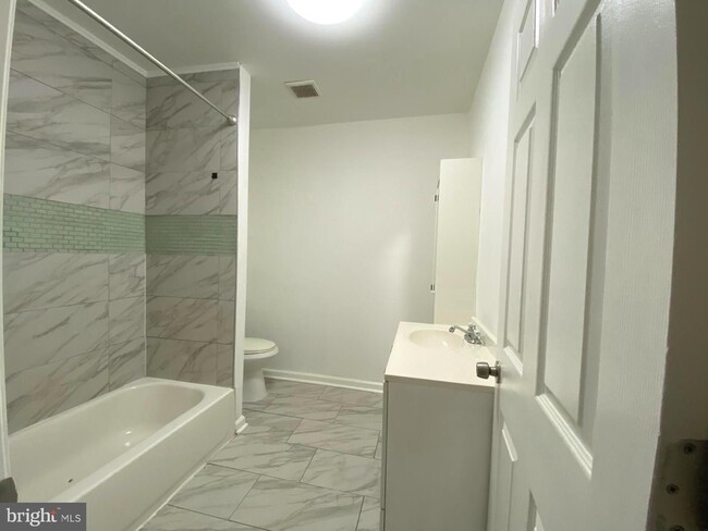 Photo - Updated 2-Bedroom Home with Finished Basement and Private Yard Near University City