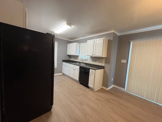 Photo - Spacious 4-Bedroom Sanctuary with Cozy Fireplace on Chimney Swift Drive!