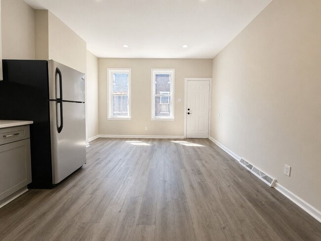 Photo - Spacious 4 Bedroom Home with Private Backyard & Flexible Living Space