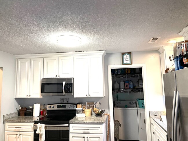 Photo - Beautifully updated 4-bedroom, 2-bathroom home located in the desirable, wooded Meadowbrook Woods...