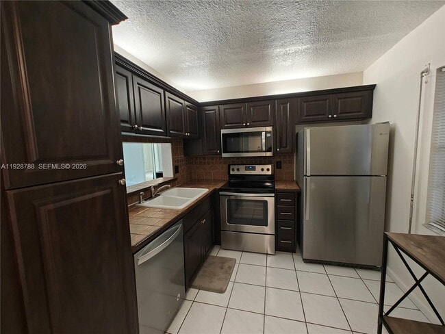 Building Photo - 8750 Royal Palm Blvd Unit 111-3