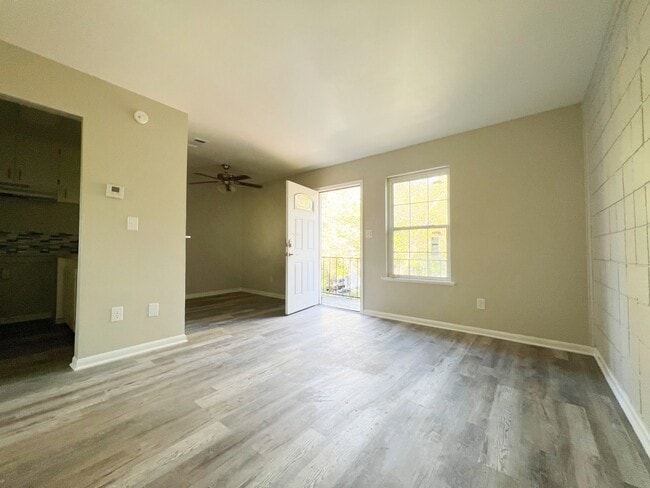 Step into a bright and sunny day from this inviting living room. - 2125 Banita St Unit 4