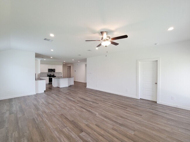 Photo - This stunning 4-bedroom, 2-bathroom Rosharon lease features modern upgrades, an open-concept layo...