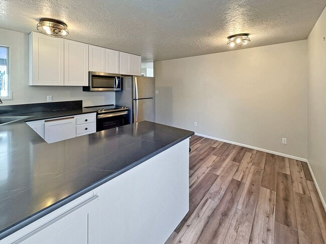 Photo - 3-Bedroom Boise Home with Outdoor Fireplace, Fenced Yard & LVP Flooring Near Downtown | $500 Off ...