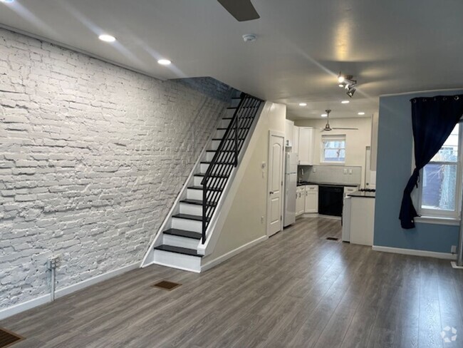 Building Photo - Modern 3-Bedroom Home with Exposed Brick &...