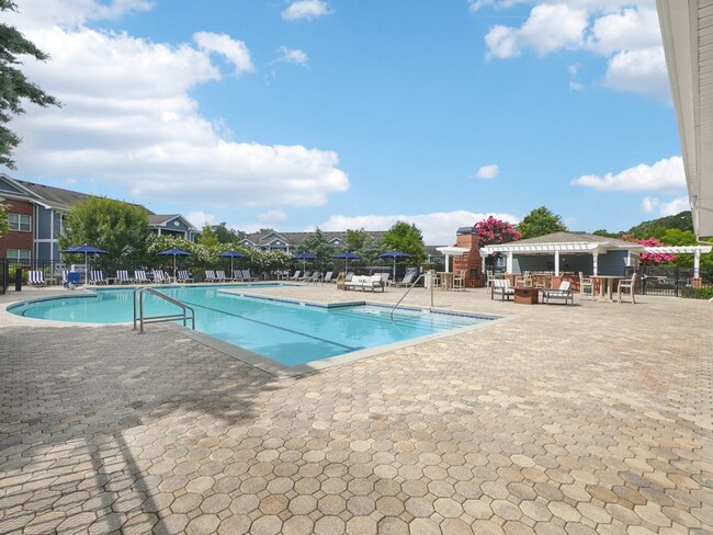 Expansive resort-style swimming pool and outdoor resident amenities at Village at Broadstone Station in Apex, North Carolina