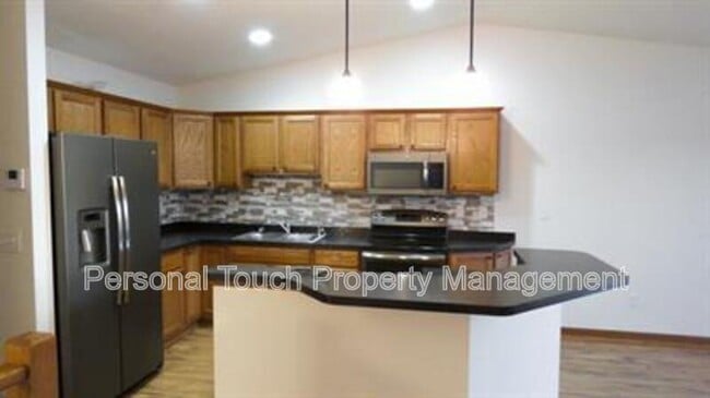 Building Photo - 2420 5th St W Unit C Rental