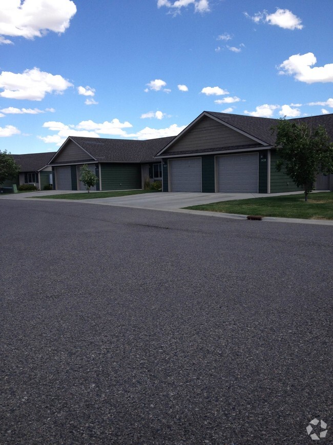 Patio homes with attached garage included in rent. - Frontier Apartments