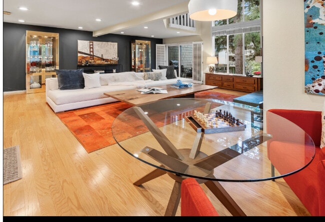 Large open light filled living with deck. - 13730 15th Ave NE Condo Unit E204