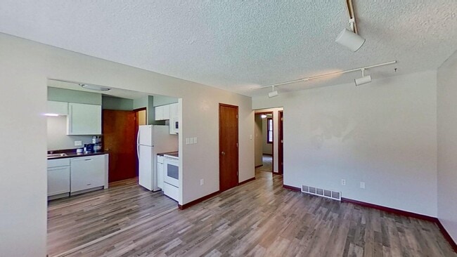 Photo - Clean three bedroom one bath duplex with walk out basement with yard looking at trees, across fro...