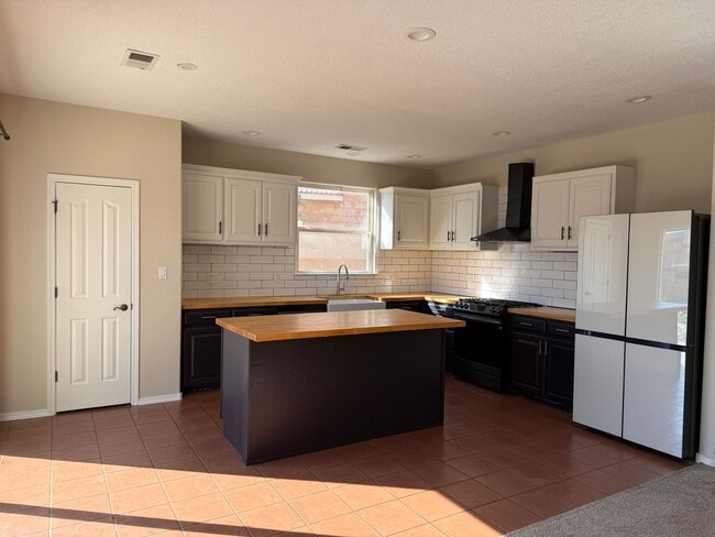 Photo - Spacious 4 Br, 2.5 Ba with 2 living areas, loft, kitchen appliances, 2 car garage.