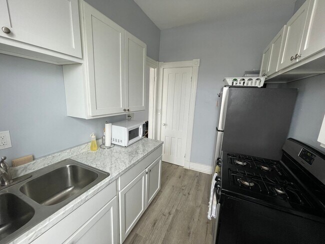 Photo - Bright & Spacious 1-Bedroom Apartment Perfect for Students | Heat & Hot Water Included | Near Cen... Unit 2F