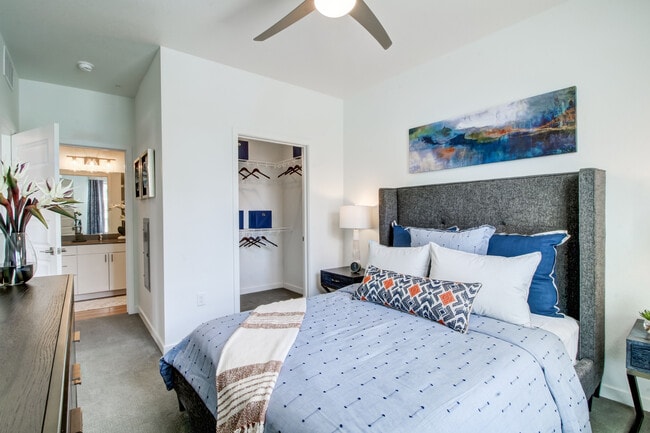 Bedroom with ceiling fan and carpeted flooring