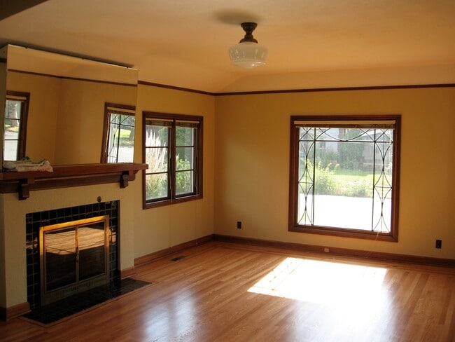 Living room with large leaded window facing west.