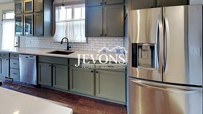 Photo - Spacious home with fully equipped kitchen and 2-car garage near Stewart Park