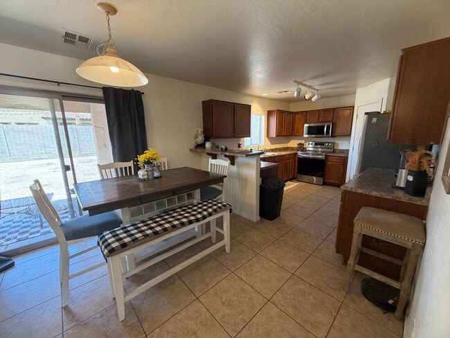 Photo - Large backyard and spacious home