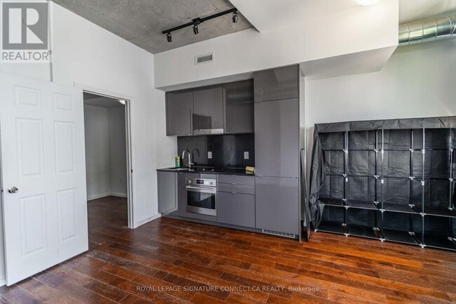 Photo - 21 Lawren Harris Square Unit 910