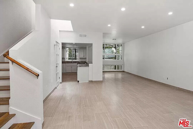 Upon entry into the Unit, you see an Open Floor Plan with Living Room, Dining Room, and Kitchen. - 10315 Missouri Ave Unit C Rental