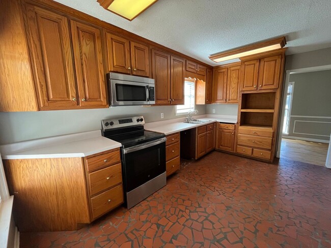 Photo - Renovated 4 Bedroom 2 Bath Home with Carport and Double Garage!!