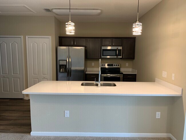Kitchen, solid surface counter/ breakfast bar - 4966 Key Lime Dr Unit 303
