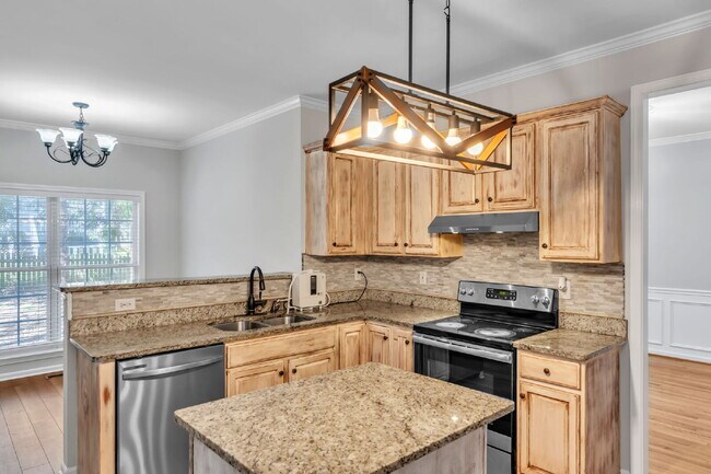 Photo - Beautifully Appointed 4BR Home Featuring a Screened Porch, Spacious Living Areas & Community Pool...