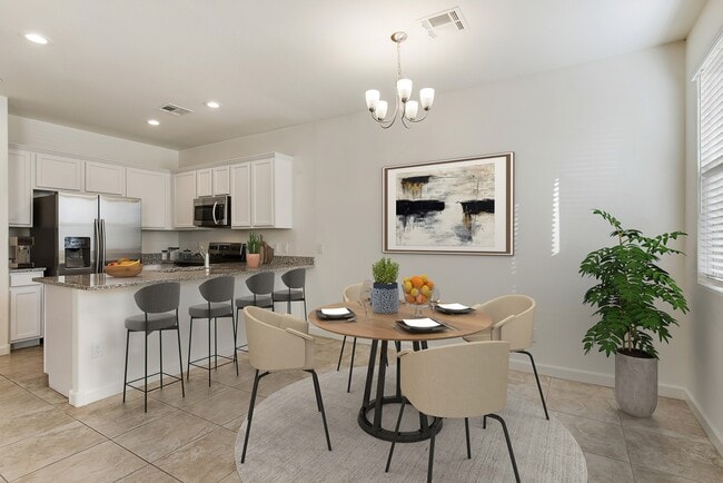 Dining area and kitchen with room for bar top seating