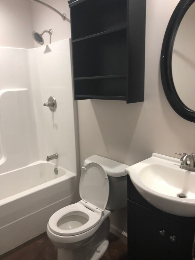 First bathroom down hallway