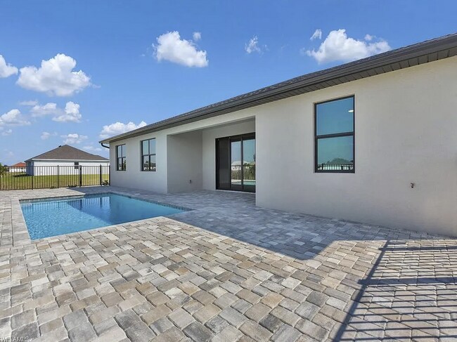 Photo - Almost New Construction Waterfront Home in NE Cape Featuring A Pool, Fenced Yard & More! COMING SOON