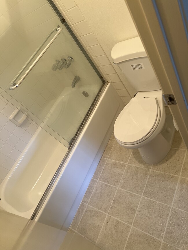 new toilet and tub - 8460 Westmore Rd Apartment Unit 394