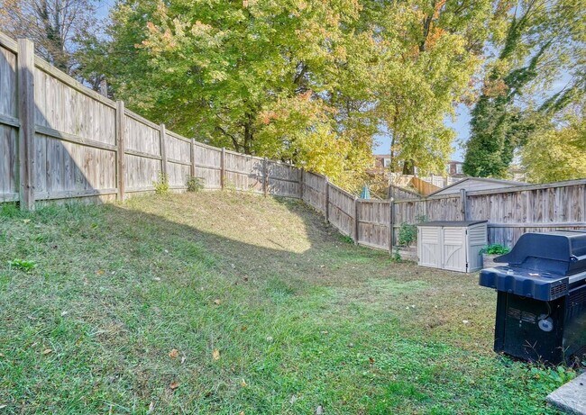Photo - Updated End-of-Group Townhome with Finished Lower Level, Fenced Yard & Community Pool