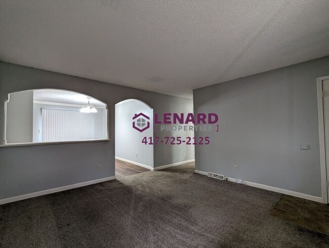 Photo - Charming 3-Bedroom Home with Fenced Yard & 2-Car Garage in Springfield
