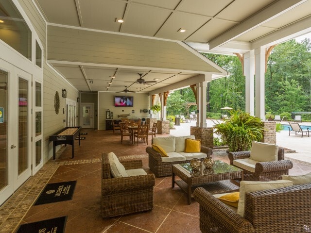 Covered entertainment area with outdoor kitchent