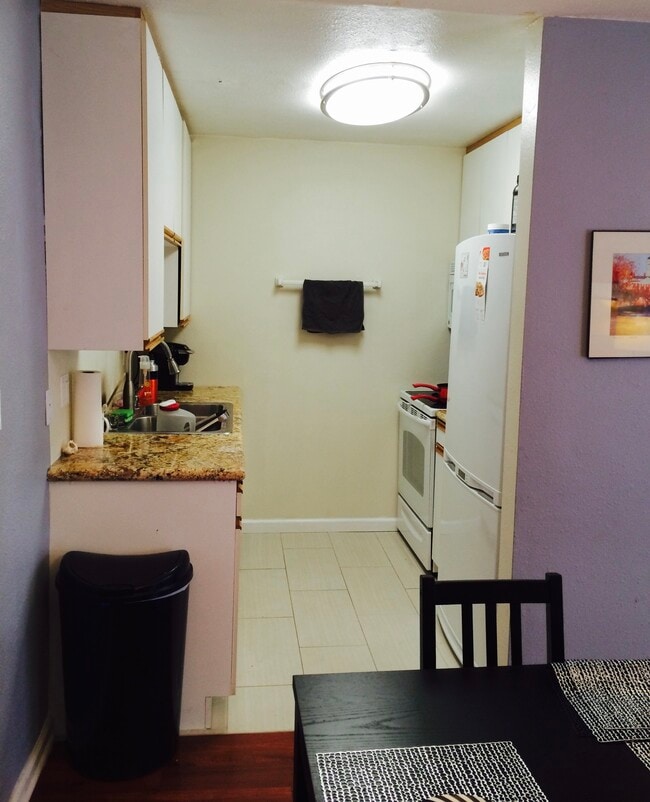 Marvel countertops in the kitchen sit on all new White appliances including a dishwasher - 970 Palm Avenue Unidad 107