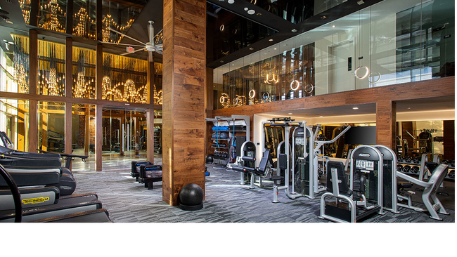 Expansive HIIT-inspired fitness center with cardio and weight stations