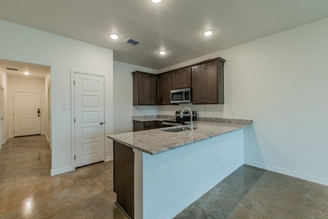 Photo - Brand New 3BR Duplex with Modern Concrete Floors & Fenced Yard! Unit B