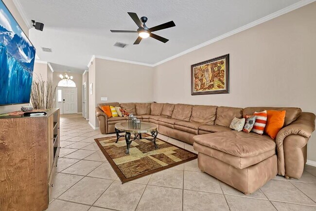 Photo - "Stunning 3BR Orlando Home with Private Screened Pool, Spa & Spacious Living Areas"
