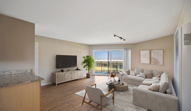 Spacious living roome with wood flooring throughout