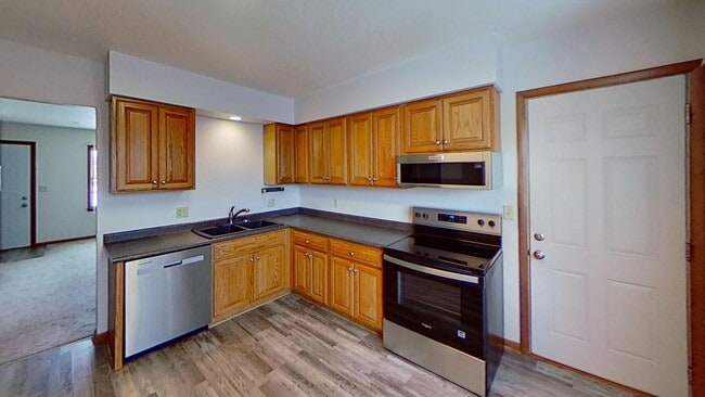 Photo - Updated two bedroom ranch duplex with partial basement finish, detached garage, close to mall/sho...