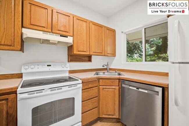 Photo - Live Steps from Microsoft | Stylish 2BR Condo with Fireplace & Parking Unit Apartment C104