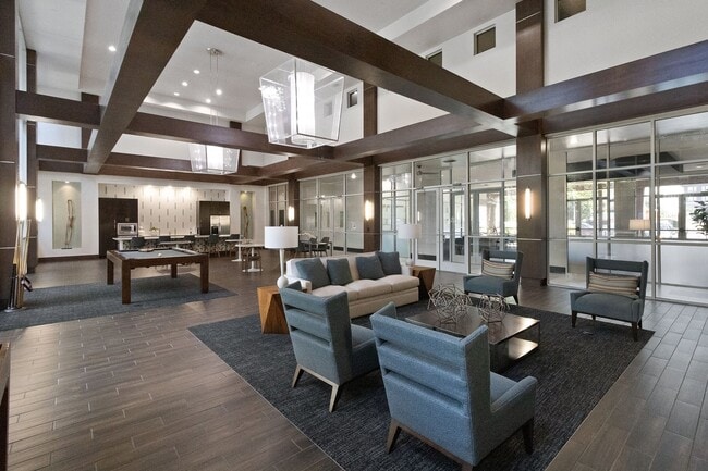 Expansive seating area with TV gallery located in resident game lounge