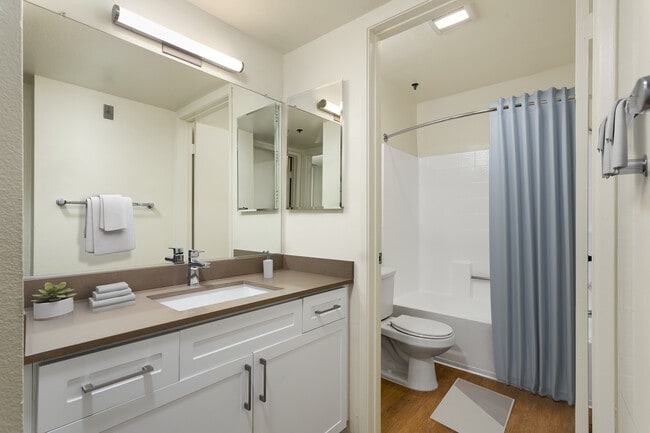 Renovated I bath with quartz countertops and hard surface flooring