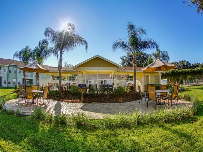 Outdoor Dining Area with Gas Grills - Providence at Palm Harbor