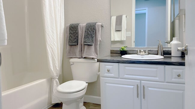 Clean, functional bathrooms feature a full bathtub for comfortable bathing, professionally operated by Highlands Vista Group.
