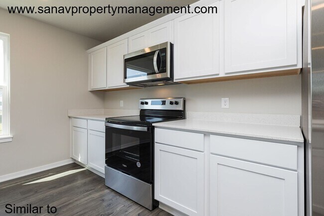 Photo - Beautiful 4BR/2.5BA Home Featuring Open-Concept Living & Modern Upgrades