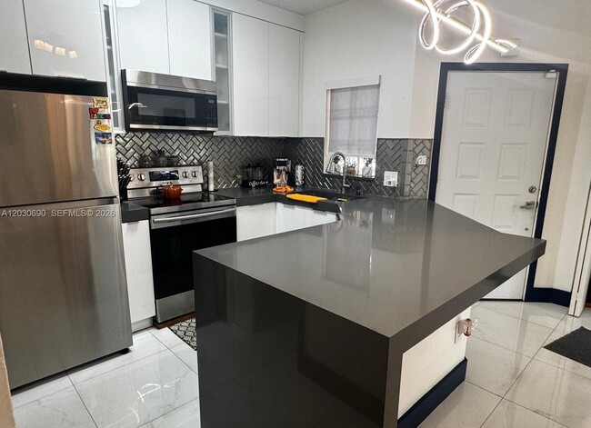 Building Photo - 18306 NW 68th Ave Unit A