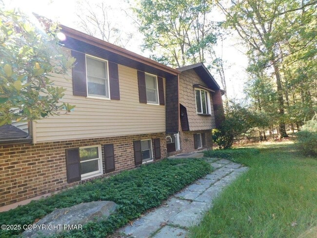 Photo - 3-bedroom, 2-bath home featuring an open f...