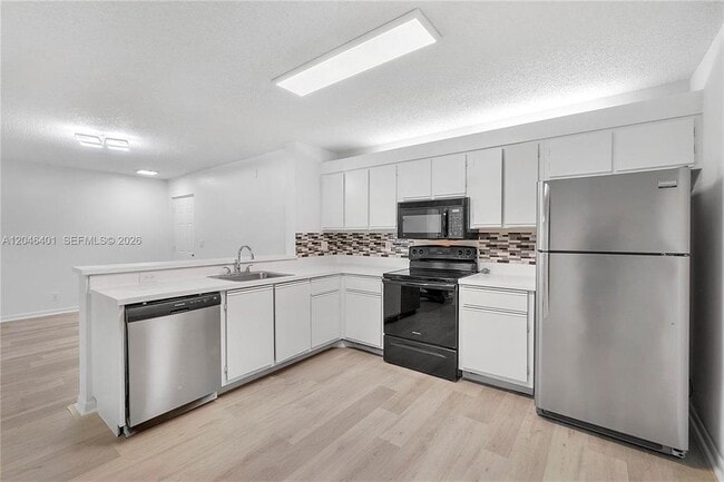 Building Photo - 5661 Riverside Dr Unit 103B7