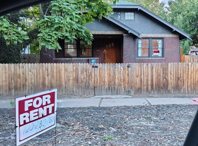 Fenced in front yard overlooking a tree draped University blvd, just steps from dining and shopping
