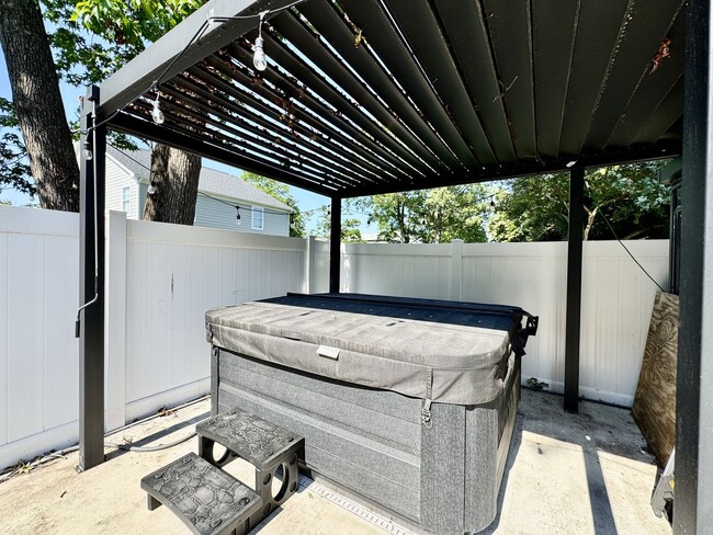 Photo - Ready NOW! A Custom Townhouse-Style Duplex Blocks to the Beaches! Fenced Yard - Hot Tub - Pet Fri...