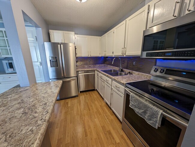 Photo - Updated 2bd/1ba Condo w/ Pool & Heated Par...